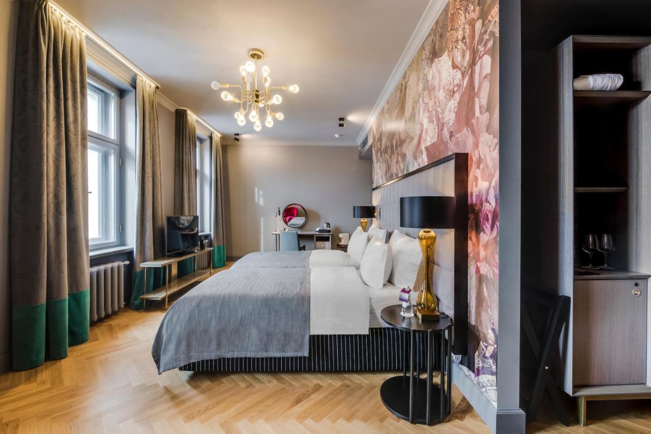 Grand Poet Hotel And Spa By Semarah Riga Luaran gambar Suite