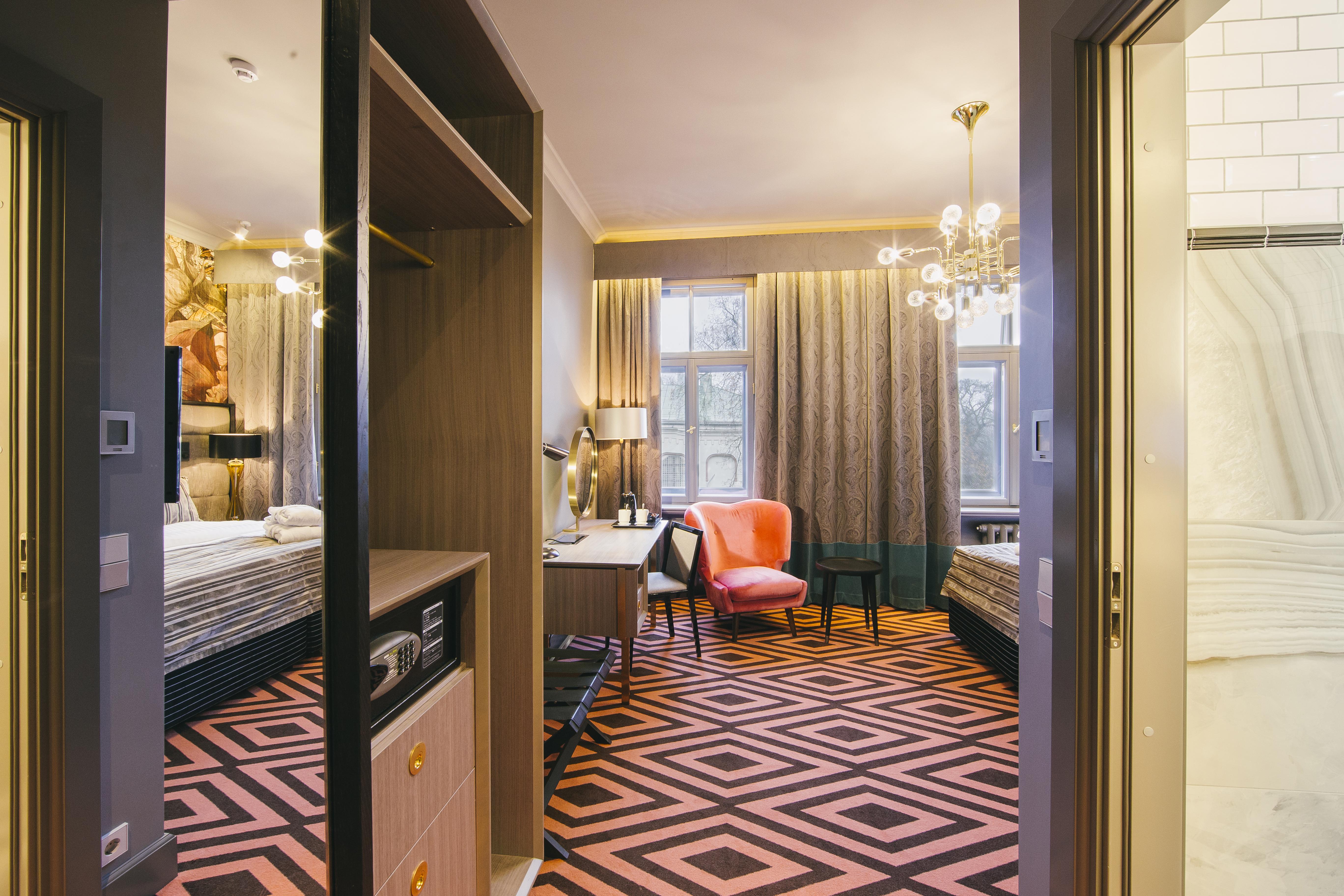 Grand Poet Hotel And Spa By Semarah Riga Luaran gambar A suite at the hotel