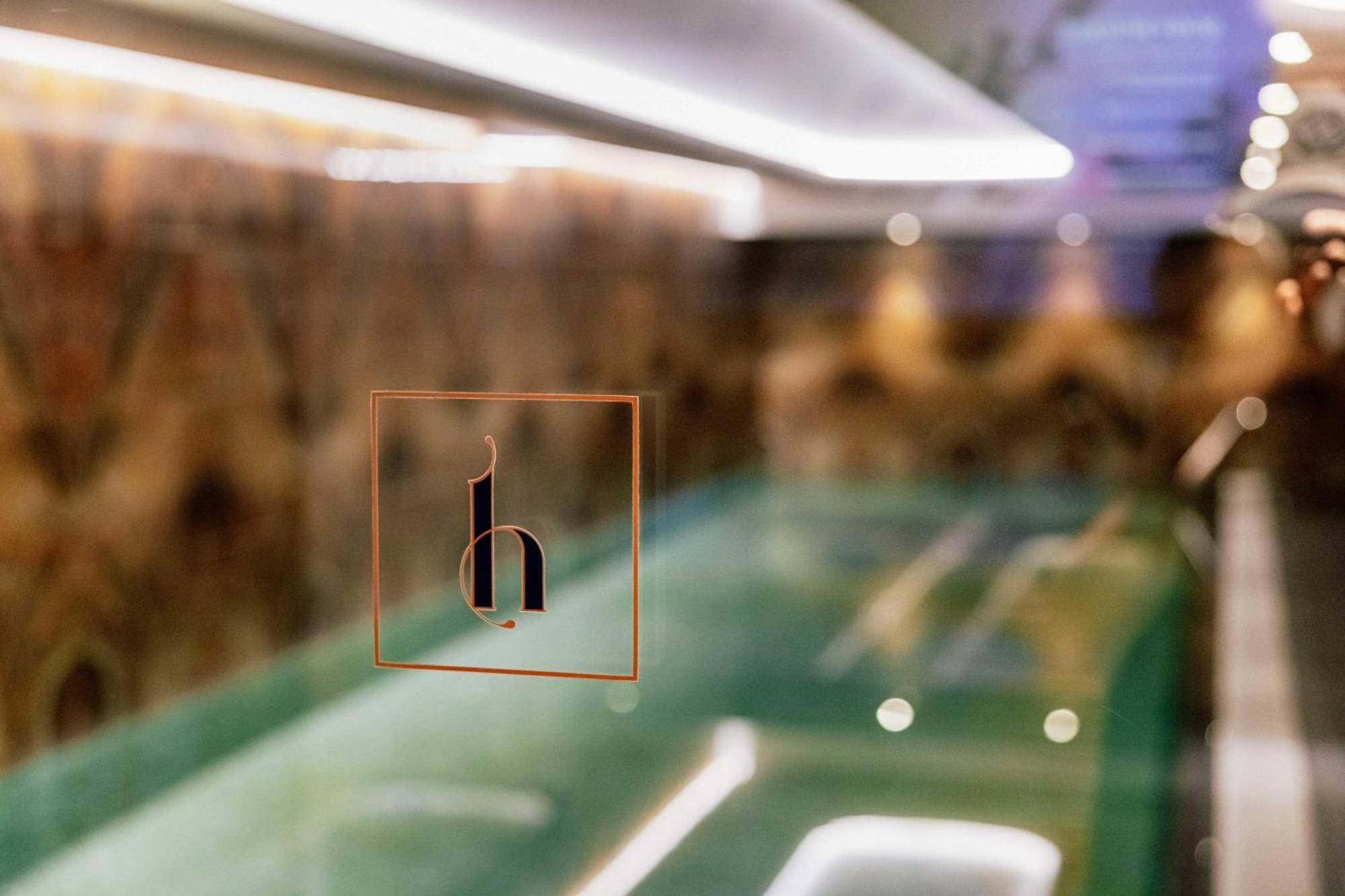 Grand Poet Hotel And Spa By Semarah Riga Luaran gambar The logo of the hotel